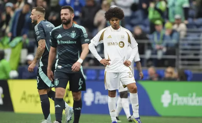 Los Angeles FC forward David Martínez, right, reacts after a goal by Seattle Sounders midfielder Albert Rusnák (not pictured) during extra time of the second half of an MLS soccer match Saturday, March 8, 2025, in Seattle. (AP Photo/Lindsey Wasson)