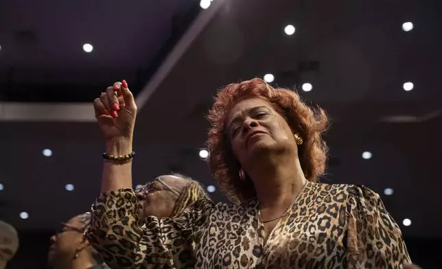 Fans and friends gather to celebrate the life of singer and actress Angie Stone, Friday, March 14, 2025, in Austell. Ga. (AP Photo/Olivia Bowdoin)