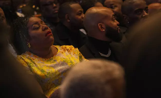 Fans and friends gather to celebrate the life of singer and actress Angie Stone, Friday, March 14, 2025, in Austell. Ga. (AP Photo/Olivia Bowdoin)