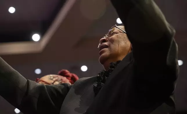 Fans and friends gather to celebrate the life of singer and actress Angie Stone, Friday, March 14, 2025, in Austell. Ga. (AP Photo/Olivia Bowdoin)