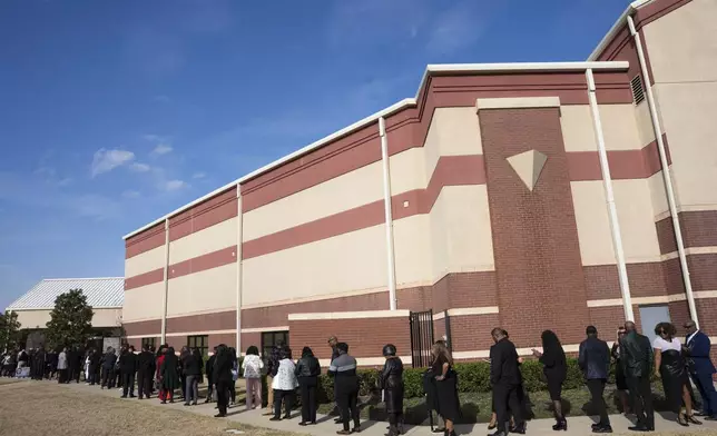 Fans and friends gather to celebrate the life of singer and actress Angie Stone, Friday, March 14, 2025, in Austell. Ga. (AP Photo/Olivia Bowdoin)