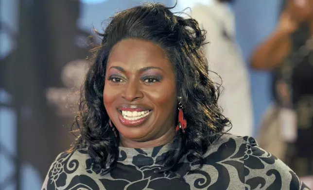 FILE - Angie Stone poses as she walks down the red carpet during the 2009 Soul Train Awards taping at the Georgia World Congress Center, Tuesday, Nov. 3, 2009 in Atlanta. (AP Photo/Gregory Smith, File)