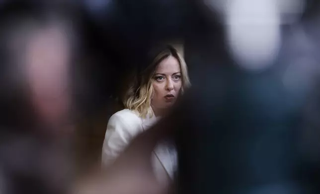 Italy's Prime Minister Giorgia Meloni speaks with the media during an EU Summit at the European Council building in Brussels, Thursday, March 6, 2025. (AP Photo/Omar Havana)