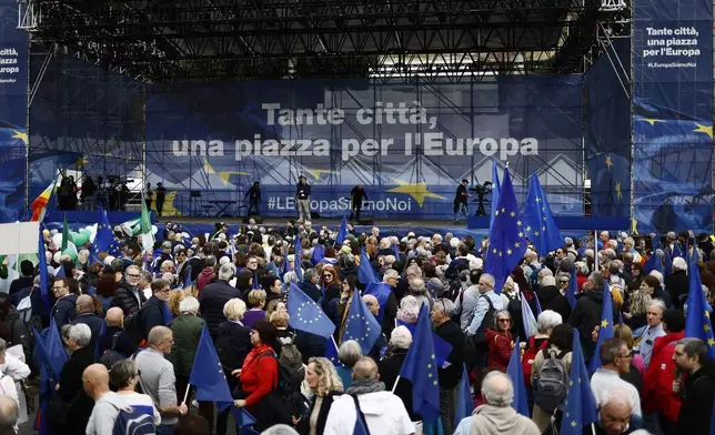 CORRECTS DATE People gather on the occasion of a Pro-Europe demonstration asking for more cohesion in the EU on the wake of the recent changes of priorities in International politics, in Rome, Saturday, March 15, 2025. (Cecilia Fabiano/LaPresse via AP)