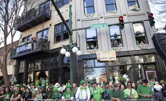 Crowds gather at the 22nd Annual World's Shortest St. Patrick's Day Parade on Monday, March 17, 2025, in Hot Springs, Ark. (AP Photo/Katie Adkins)