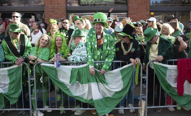 Crowds gather at the 22nd Annual World's Shortest St. Patrick's Day Parade on Monday, March 17, 2025, in Hot Springs, Ark. (AP Photo/Katie Adkins)
