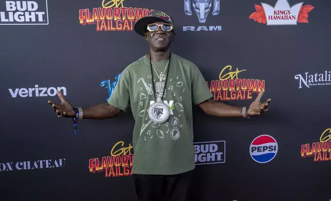 FILE - Flavor Flav attends Guy Fieri's Flavortown Tailgate on Sunday, Feb. 9, 2025, in New Orleans. (Photo by Amy Harris/Invision/AP, File)