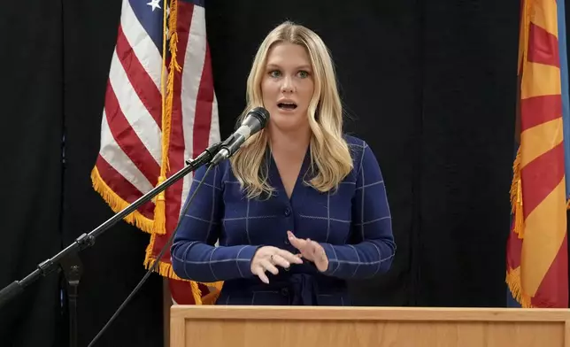 Ashley Holden of ABC 15 Arizona speaks about witnessing the execution of inmate Aaron Brian Gunches at the Arizona State Prison Wednesday, March 19, 2025 in Florence, Ariz. (AP Photo/Darryl Webb)