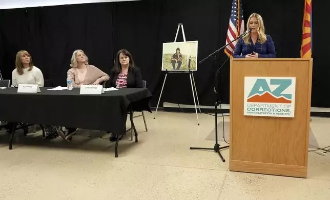 Ashley Holden of ABC 15 Arizona speaks about witnessing the execution of inmate Aaron Brian Gunches as counsel and family members of the victim look on during a press briefing at the Arizona State Prison Wednesday, March 19, 2025 in Florence, Ariz. (AP Photo/Darryl Webb)