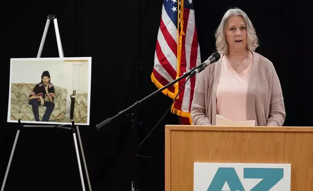 Karen Price sister of Ted Price (pictured off the left) speaks about the execution of Aaron Brian Gunches at the Arizona State Prison Wednesday, March 19, 2025 in Florence, Ariz. Gunches murdered Ted Price in 2002. (AP Photo/Darryl Webb)
