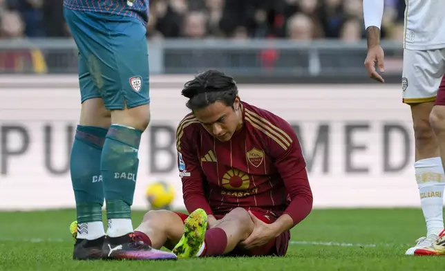 Roma's Paulo Dybala lies on the pitch during the Serie A soccer match between Roma and Cagliari at Rome's Olympic stadium, Sunday, March 16, 2025. (Fabrizio Corradetti/LaPresse via AP)