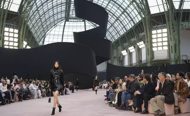 A model wears a creation as part of the Chanel Fall/Winter 2025-2026 Womenswear collection presented Tuesday, March 11, 2025. in Paris. (Photo by Scott A Garfitt/Invision/AP)