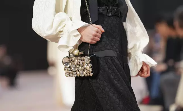 A model wears a creation as part of the Chanel Fall/Winter 2025-2026 Womenswear collection presented Tuesday, March 11, 2025. in Paris. (Photo by Scott A Garfitt/Invision/AP)