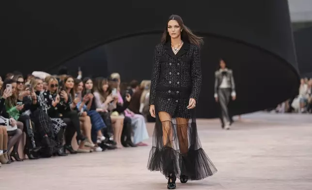 Vittoria Ceretti wears a creation as part of the Chanel Fall/Winter 2025-2026 Womenswear collection presented Tuesday, March 11, 2025. in Paris. (Photo by Scott A Garfitt/Invision/AP)