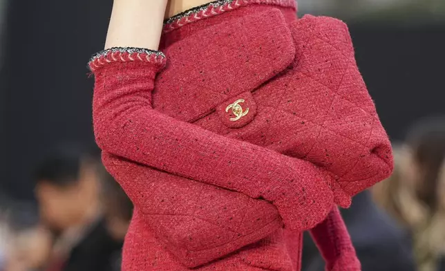 A model wears a creation as part of the Chanel Fall/Winter 2025-2026 Womenswear collection presented Tuesday, March 11, 2025. in Paris. (Photo by Scott A Garfitt/Invision/AP)