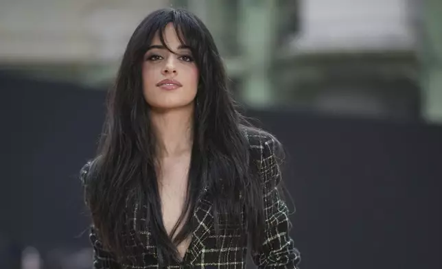 Camila Cabello arrives for the the Chanel Fall/Winter 2025-2026 Womenswear collection presented Tuesday, March 11, 2025. in Paris. (AP Photo/Christophe Ena).