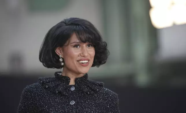 Raye arrives for the the Chanel Fall/Winter 2025-2026 Womenswear collection presented Tuesday, March 11, 2025. in Paris. (AP Photo/Christophe Ena).