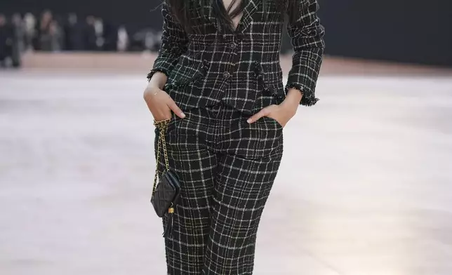 Camila Cabello arrives for the the Chanel Fall/Winter 2025-2026 Womenswear collection presented Tuesday, March 11, 2025. in Paris. (AP Photo/Christophe Ena).