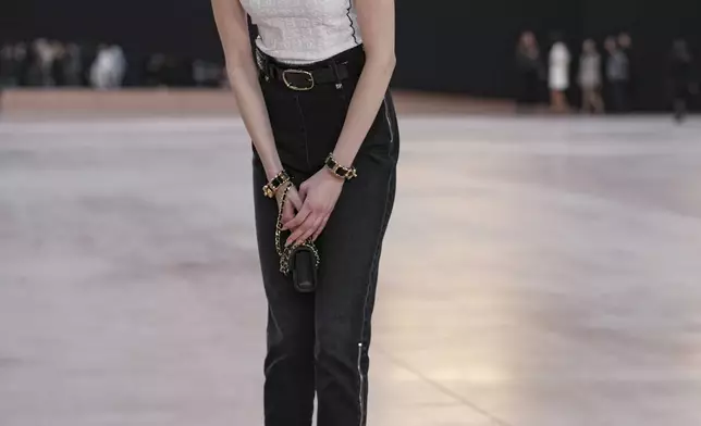 Loreta Peralta arrives for the the Chanel Fall/Winter 2025-2026 Womenswear collection presented Tuesday, March 11, 2025. in Paris. (AP Photo/Christophe Ena).