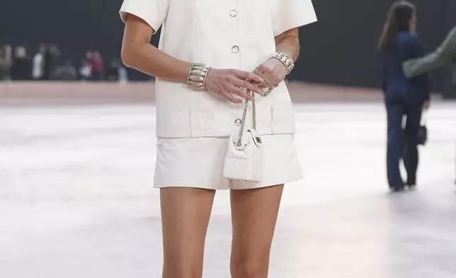 Constance Tsang arrives for the the Chanel Fall/Winter 2025-2026 Womenswear collection presented Tuesday, March 11, 2025. in Paris. (AP Photo/Christophe Ena).