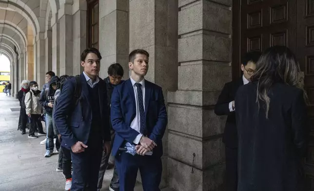 Representatives from the Italy and EU consulates wait outside the Court of Final Appeal in Hong Kong, Thursday, March 6, 2025. (AP Photo/Chan Long Hei)