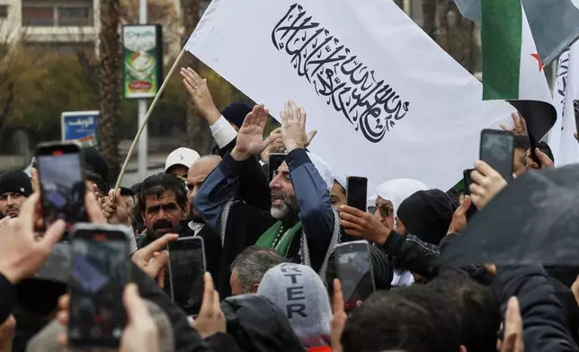 Supporters of Syria's new government gather after the prayer in Umayyad square in Damascus, Syria, Friday March 7, 2025.(AP Photo/Omar Sanadiki)
