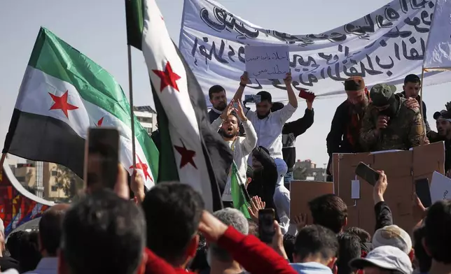 Supporters of Syria's new government gather after the prayer in Umayyad square in Damascus, Syria, Friday March 14, 2025.(AP Photo/Omar Sanadiki)