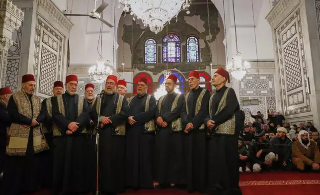 A group of sheikhs call for the prayer during the Muslim holy month of Ramadan at the Umayyad Mosque in Damascus, Syria, Friday March 7, 2025.(AP Photo/Omar Sanadiki)