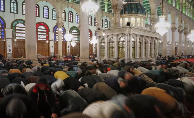 Muslim worshippers pray during the Muslim holy month of Ramadan at the Umayyad Mosque in Damascus, Syria, Friday March 7, 2025. (AP Photo/Omar Sanadiki)