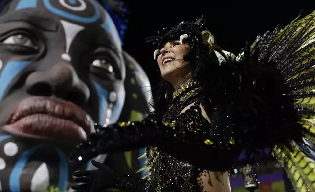 A performer from the Unidos da Tijuca samba school dances during Carnival celebrations at the Sambadrome in Rio de Janeiro, Monday, March 3, 2025. (AP Photo/Bruna Prado)