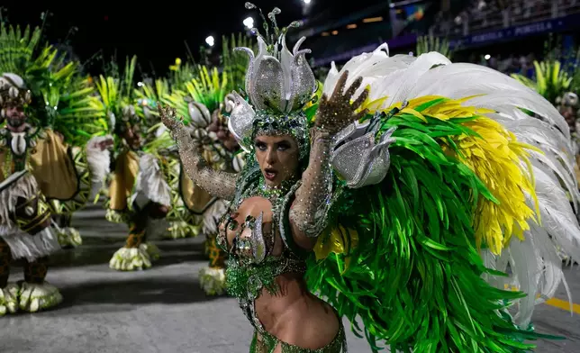 A performer from the Unidos da Tijuca samba school dances during Carnival celebrations at the Sambadrome in Rio de Janeiro, Monday, March 3, 2025. (AP Photo/Bruna Prado)