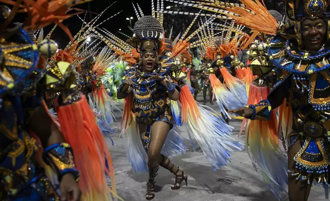 Performers from the Unidos da Tijuca samba school dance during Carnival celebrations at the Sambadrome in Rio de Janeiro, Monday, March 3, 2025. (AP Photo/Bruna Prado)