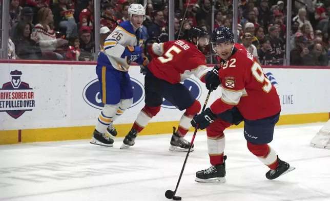 Florida Panthers left wing Tomas Nosek (92) skates with the puck during the first period of an NHL hockey game against the Buffalo Sabres, Saturday, March 8, 2025, in Sunrise, Fla. (AP Photo/Lynne Sladky)