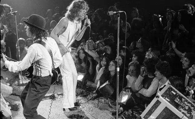 FILE - Rock group "The New York Dolls" perform at the Waldorf Halloween Ball, Waldorf-Astoria Hotel, NYC, Oct. 31, 1973. At right is lead singer David Johansen, with guitarist Sylvain Sylvain. (AP Photo/Richard Drew, File)