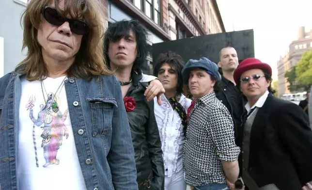FILE - The New York Dolls are photographed in New York, July 25, 2006. From left are David Johansen, Sami Yaffa, Steve Conte, Sylvain Sylvain, Brian Delaney, rear, and Brian Koonin. (AP Photo/Jim Cooper, File)
