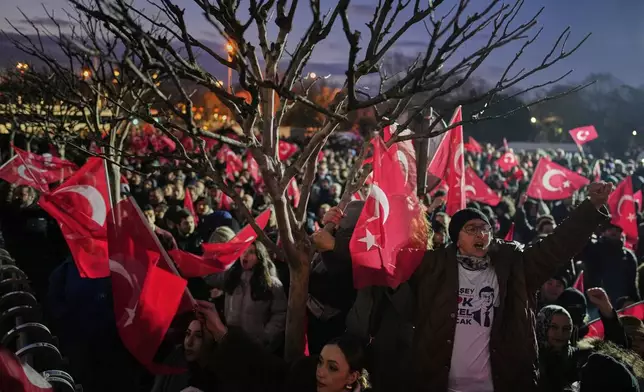People gather outside the City Hall to protest the arrest of Istanbul Mayor Ekrem Imamoglu in Istanbul, Turkey, Wednesday, March 19, 2025. (AP Photo/Emrah Gurel)