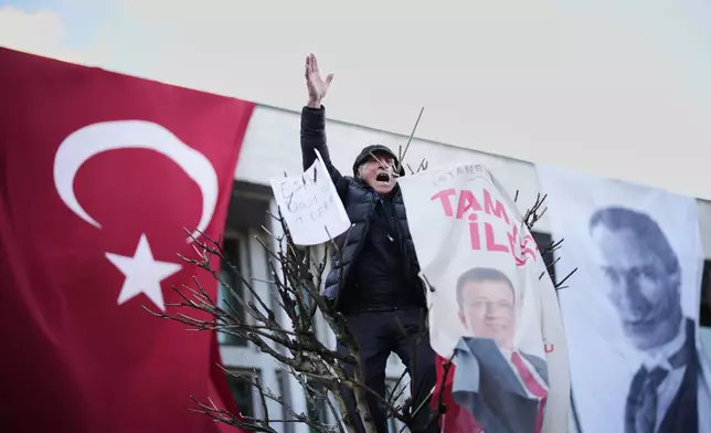 People gather outside the City Hall to protest the arrest of Istanbul Mayor Ekrem Imamoglu in Istanbul, Turkey, Wednesday, March 19, 2025. (AP Photo/Emrah Gurel)