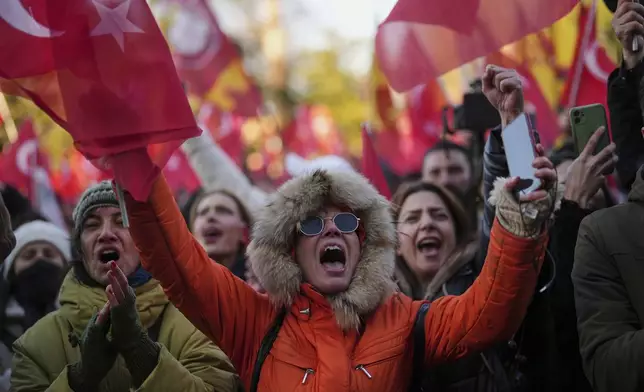 People gather outside the City Hall to protest the arrest of Istanbul Mayor Ekrem Imamoglu in Istanbul, Turkey, Wednesday, March 19, 2025. (AP Photo/Francisco Seco)