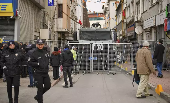 Police cordon off the roads leading to the Vatan Security Department, where Istanbul Mayor Ekrem Imamoglu is expected to be taken following his arrest in Istanbul, Turkey, on Wednesday, March 19, 2025. (AP Photo/Emrah Gurel)