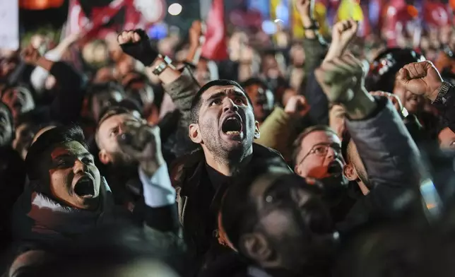 People gather outside the City Hall to protest the arrest of Istanbul Mayor Ekrem Imamoglu in Istanbul, Turkey, Wednesday, March 19, 2025. (AP Photo/Francisco Seco)