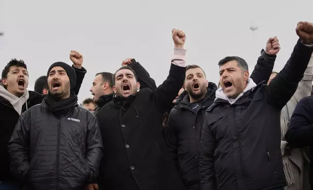 People chant slogans as they protest outside the Vatan Security Department, where Istanbul Mayor Ekrem Imamoglu is expected to be taken following his arrest in Istanbul, Turkey, on Wednesday, March 19, 2025. (AP Photo/Emrah Gurel)