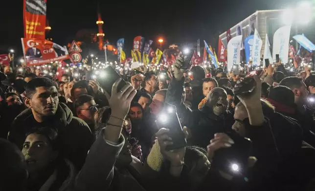 People gather outside the City Hall to protest the arrest of Istanbul Mayor Ekrem Imamoglu in Istanbul, Turkey, Wednesday, March 19, 2025. (AP Photo/Francisco Seco)