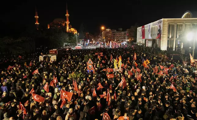 People gather outside the City Hall to protest the arrest of Istanbul Mayor Ekrem Imamoglu in Istanbul, Turkey, Wednesday, March 19, 2025. (AP Photo/Emrah Gurel)