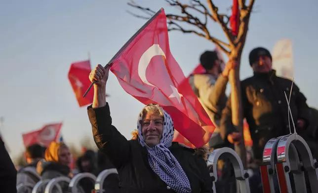 People gather outside the City Hall to protest the arrest of Istanbul Mayor Ekrem Imamoglu in Istanbul, Turkey, Wednesday, March 19, 2025. (AP Photo/Francisco Seco)