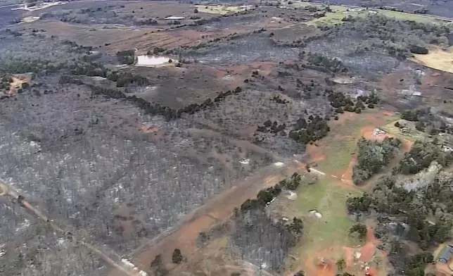 This image provided by shows aerials over the damage caused by the wildfires in Logan County, Okla. (KOCO via AP)