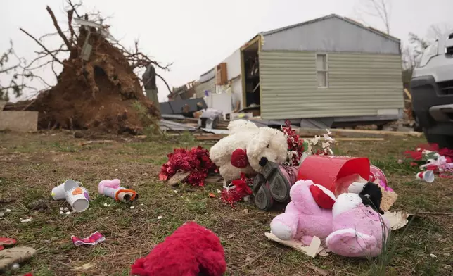 Debris from a severe storm is scattered outside a damaged home Saturday, March 15, 2025, in Wayne County, Mo. (AP Photo/Jeff Roberson)