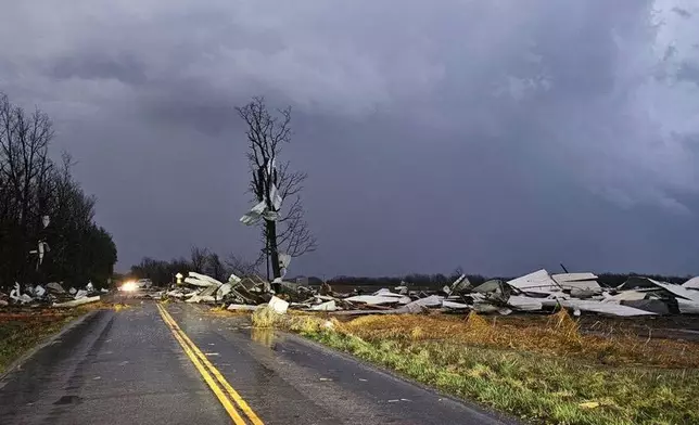 Debris covers the road during a severe storm passed the area north of Seymour, Mo., in Webster County late Friday, March 14, 2025. (Trooper Austin James/Missouri State Highway Patrol via AP)