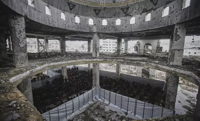 Palestinians pray during the first Friday prayers of the Muslim holy month of Ramadan at the Imam Shafi'i Mosque, damaged by Israeli army strikes, in the Zeitoun neighborhood in Gaza City, Friday March 7, 2025.(AP Photo/(AP Photo/Jehad Alshrafi)