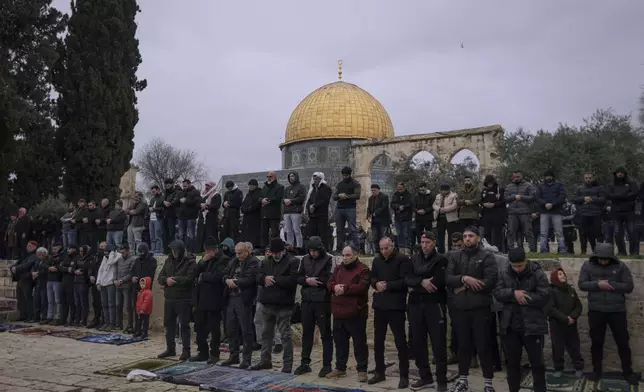 Muslim worshippers perform Friday prayers at the Al-Aqsa Mosque compound in the Old City of Jerusalem, during the holy month of Ramadan, Friday, March 7, 2025. (AP Photo/Mahmoud Illean)