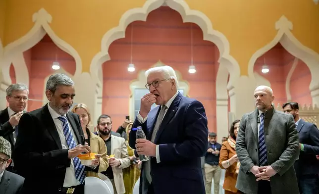German President Frank-Walter Steinmeier joins fasting Muslims at an Iftar dinner at the Wilmersdorf mosque, during the Muslim holy month of Ramadan in Berlin, Germany, Wednesday, March 12, 2025. (AP Photo/Ebrahim Noroozi)